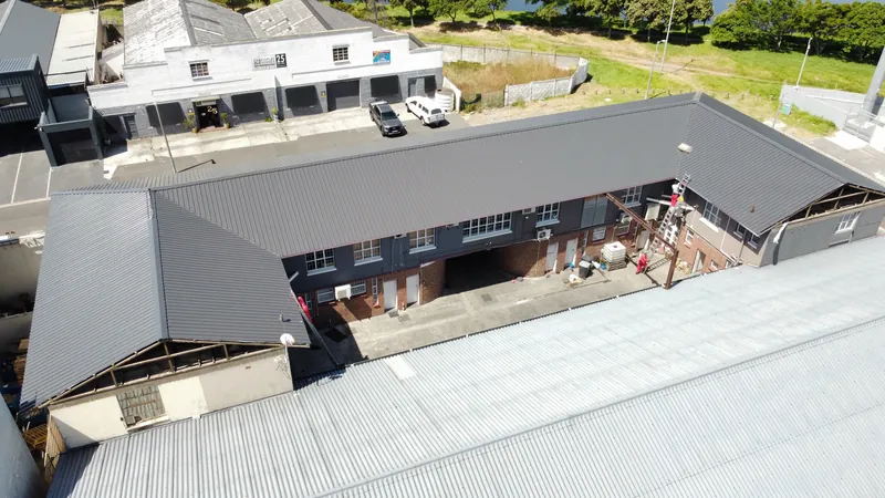 Completed dark metal roof covering around the courtyard